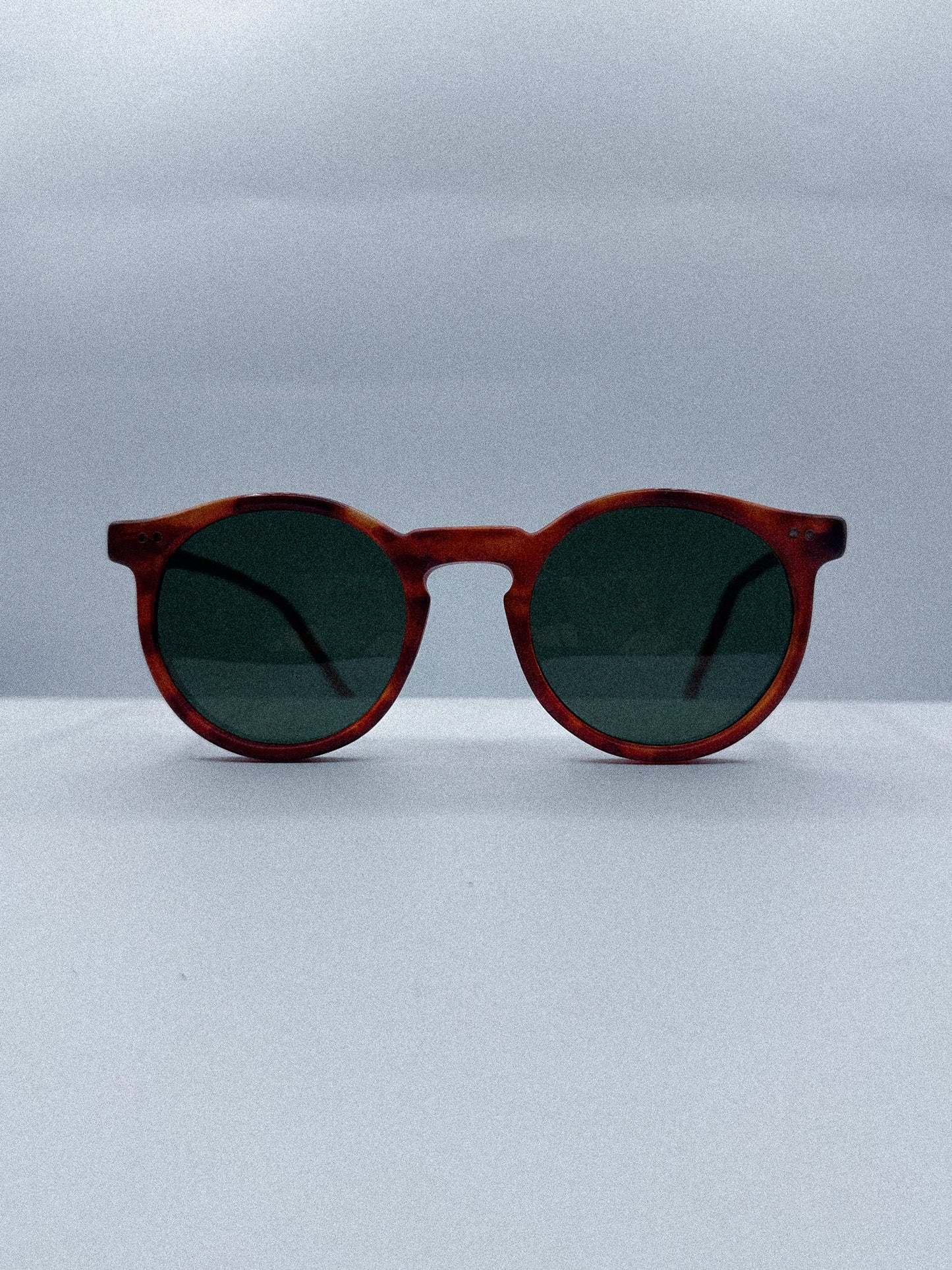 Curvy 1980s Designer Sunglasses front side
