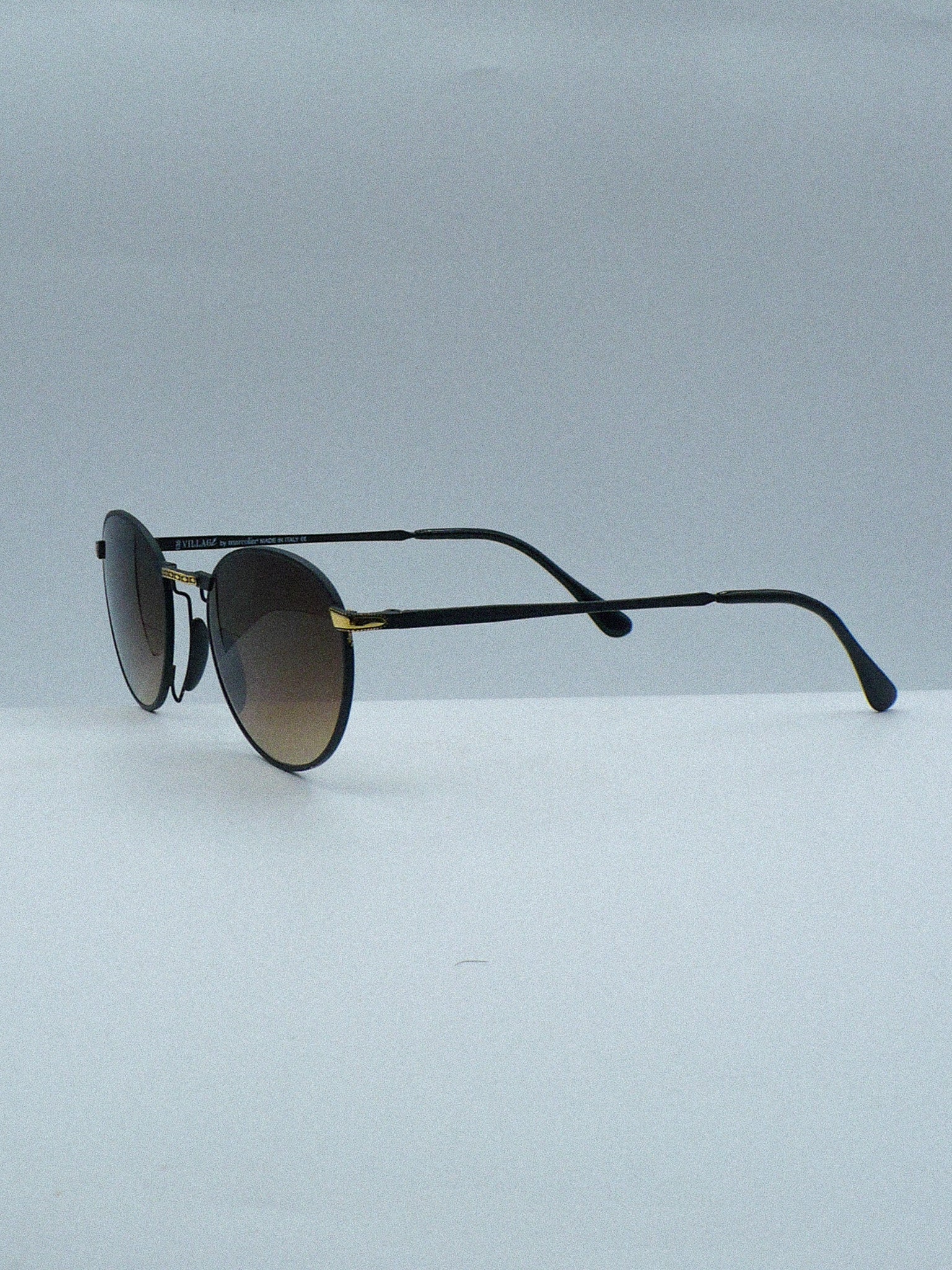 E Village 2000s Marcolin Luxury Sunglasses left side