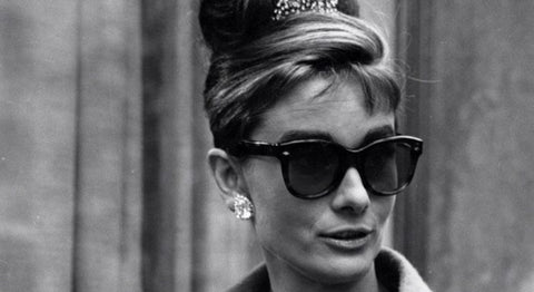 1950s vintage Ray-Ban cat-eye sunglasses advertisement featuring green frames and retro styling