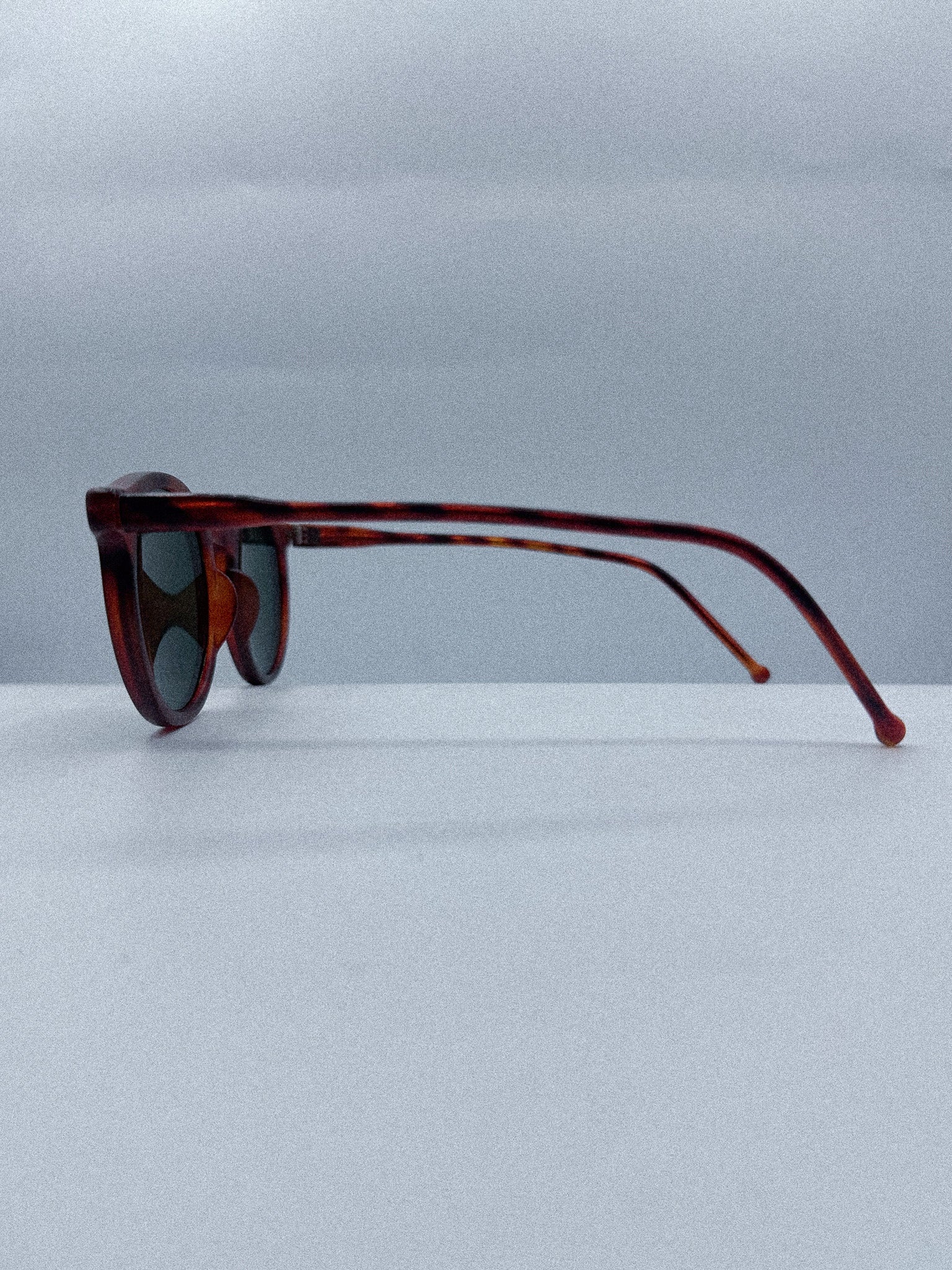 Curvy 1980s Designer Sunglasses left side