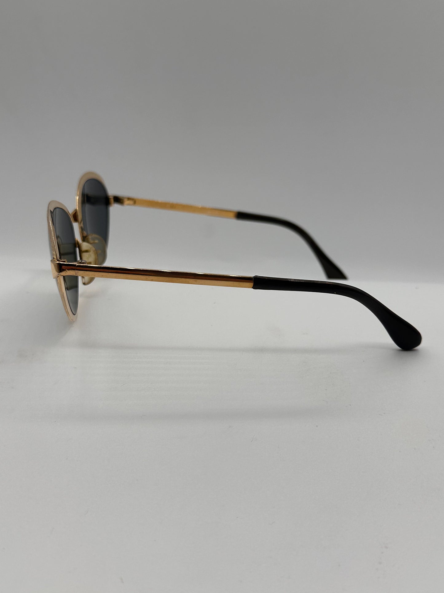 Glamour 1960s Optima gold vintage sunglasses, left side